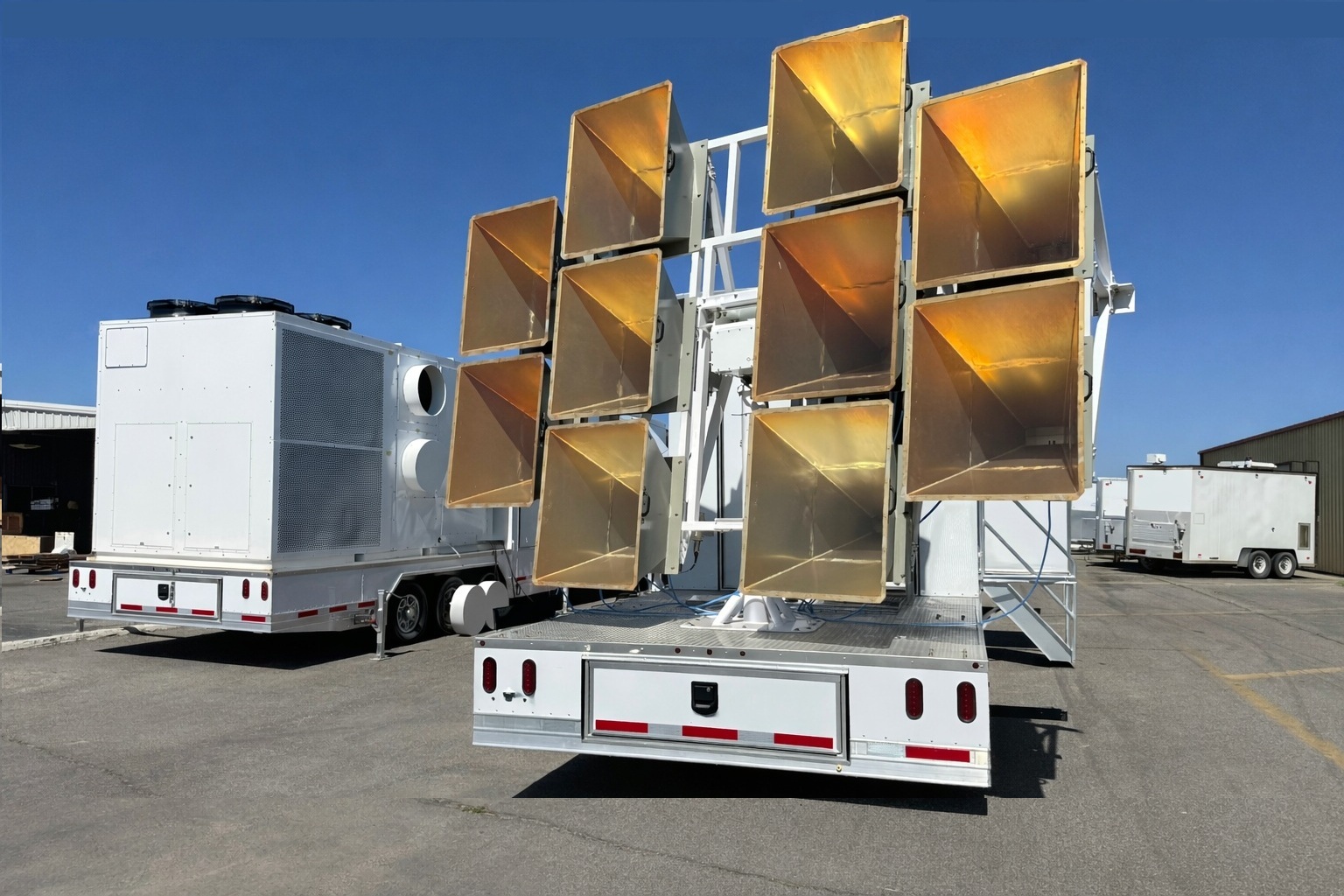 Industrial trailers under clear sky